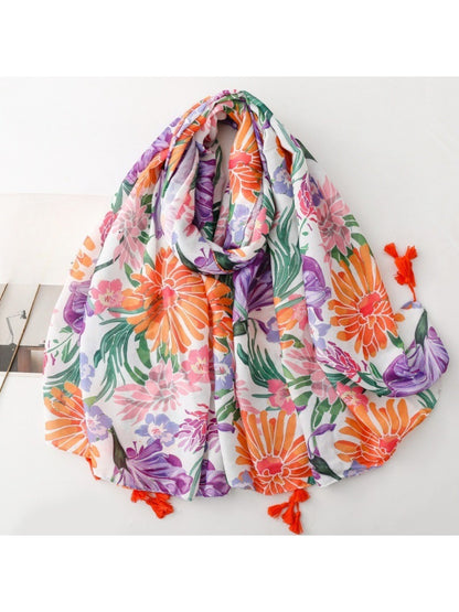 Scarvii Tropical Bloom Tassel Scarf folded showing vibrant floral pattern and tassel edges