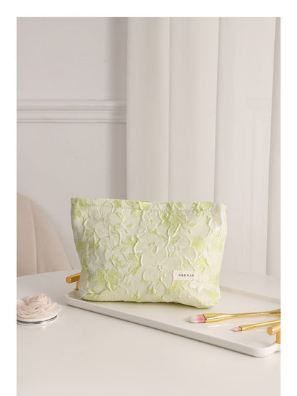 Cosbai floral cosmetic bag standing on a wooden surface with natural light