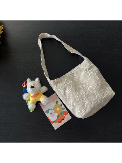 Cosbai tote bag placed on wooden surface with lighting