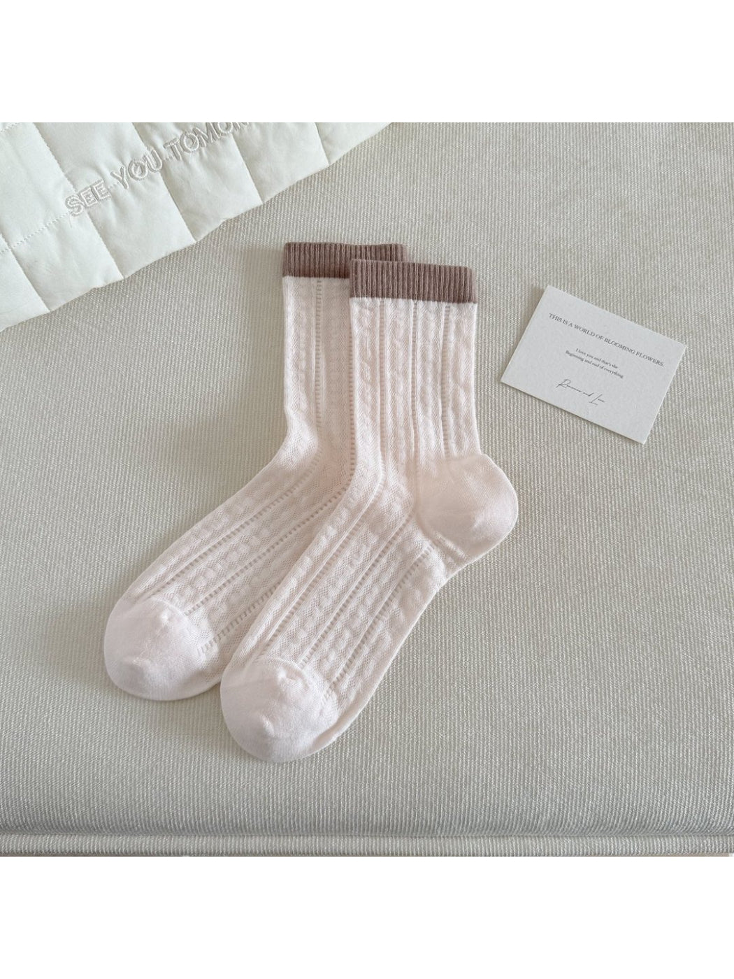 Rufia socks laid flat showing full length and colourblock design