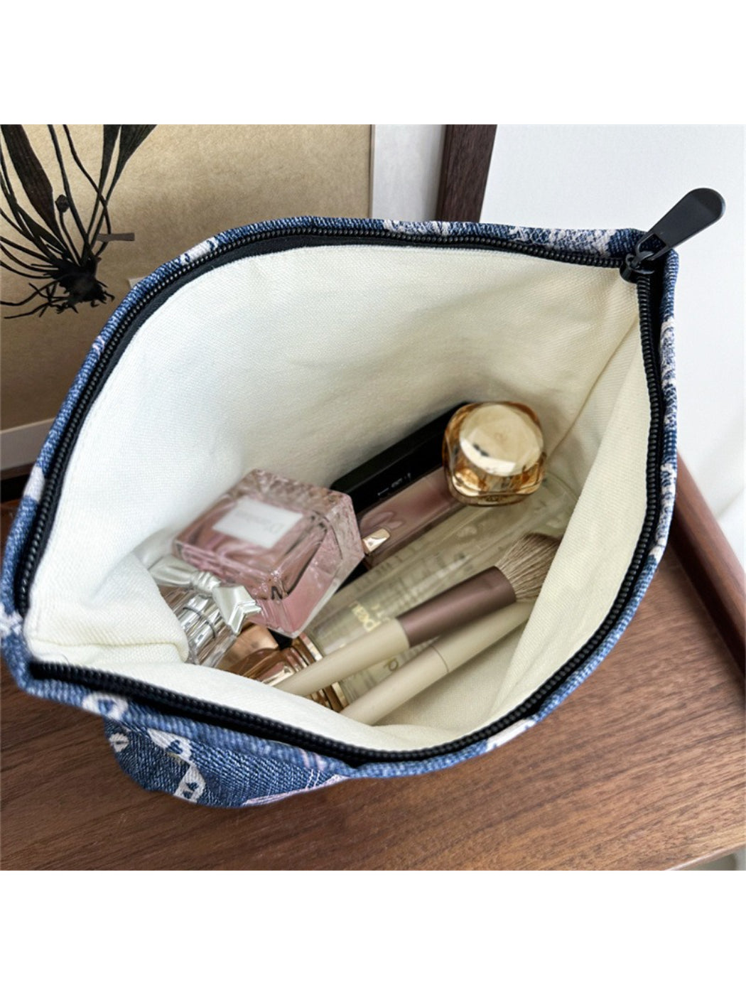 Cosbai vintage lace cosmetic pouch partially open showing fabric lining