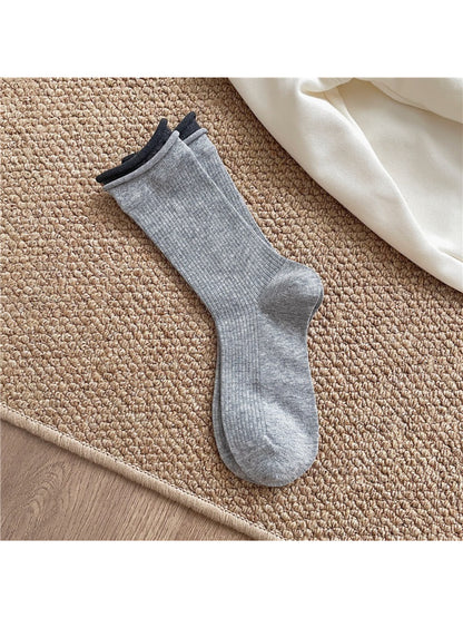 Multiple pairs of Rufia casual roll cuff crew socks in assorted colors