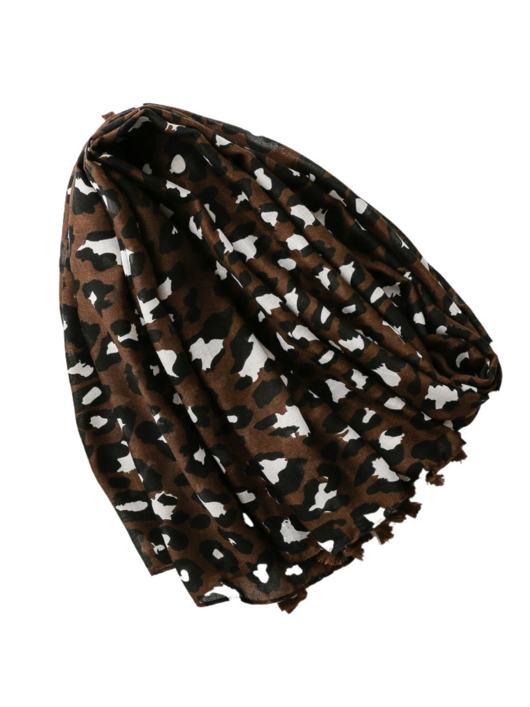 Close-up of brown leopard print fabric texture on scarf