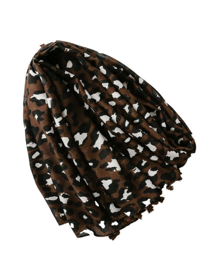 Close-up of brown leopard print fabric texture on scarf