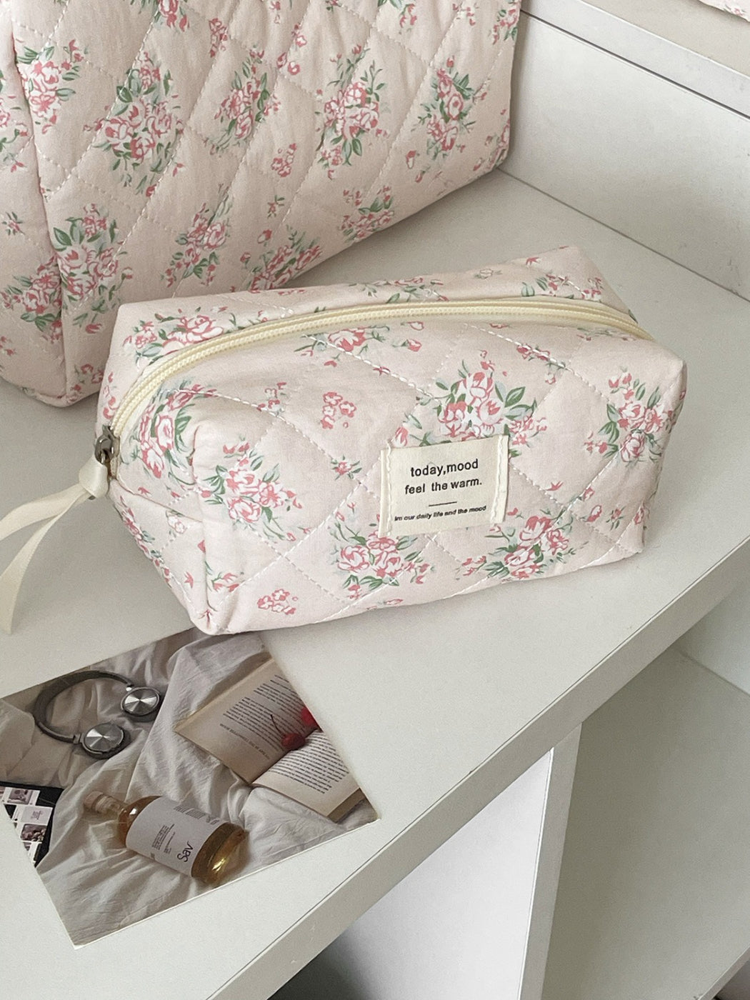 Inside view of Cosbai floral quilted makeup bag showing spacious and lining