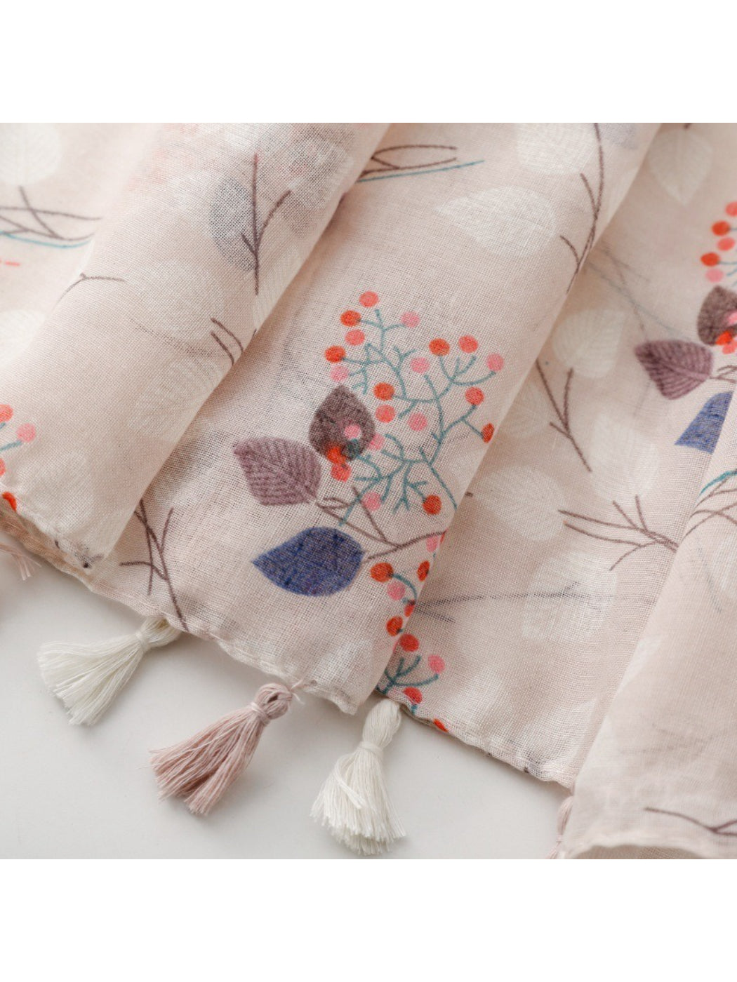 Model styling the scarf as a head wrap with visible botanical print