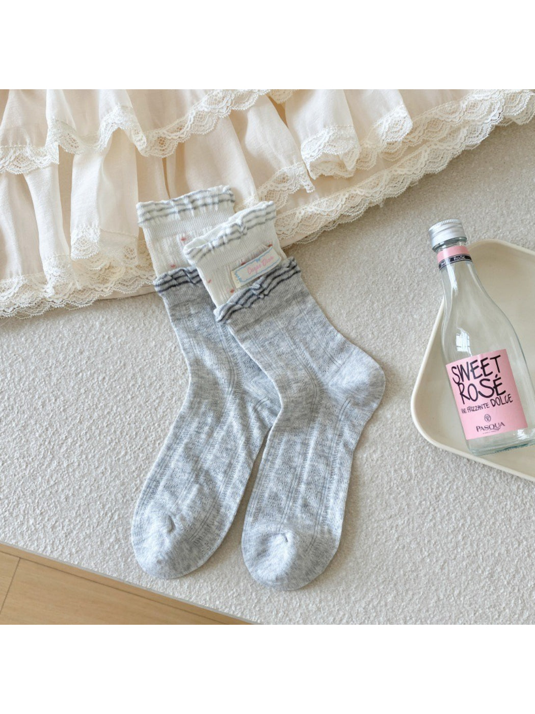 Rufia socks styled with casual shoes emphasizing the ribbon accent
