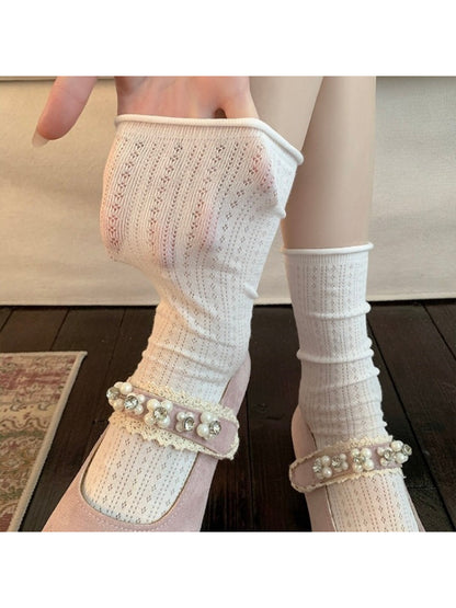 Pair of Rufia ribbed mid-calf socks in neutral beige color