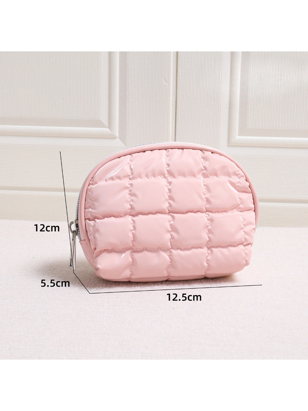 Side view of Cosbai Quilted Half Moon Cosmetic Case showing curved half moon shape