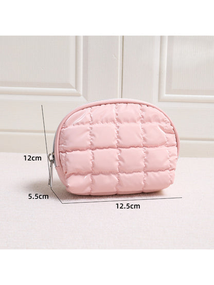Side view of Cosbai Quilted Half Moon Cosmetic Case showing curved half moon shape