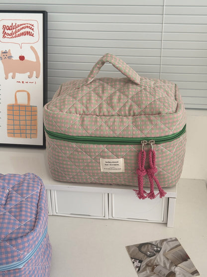 Side view of Cosbai Puffy Check Travel Makeup Bag highlighting its puffy check pattern