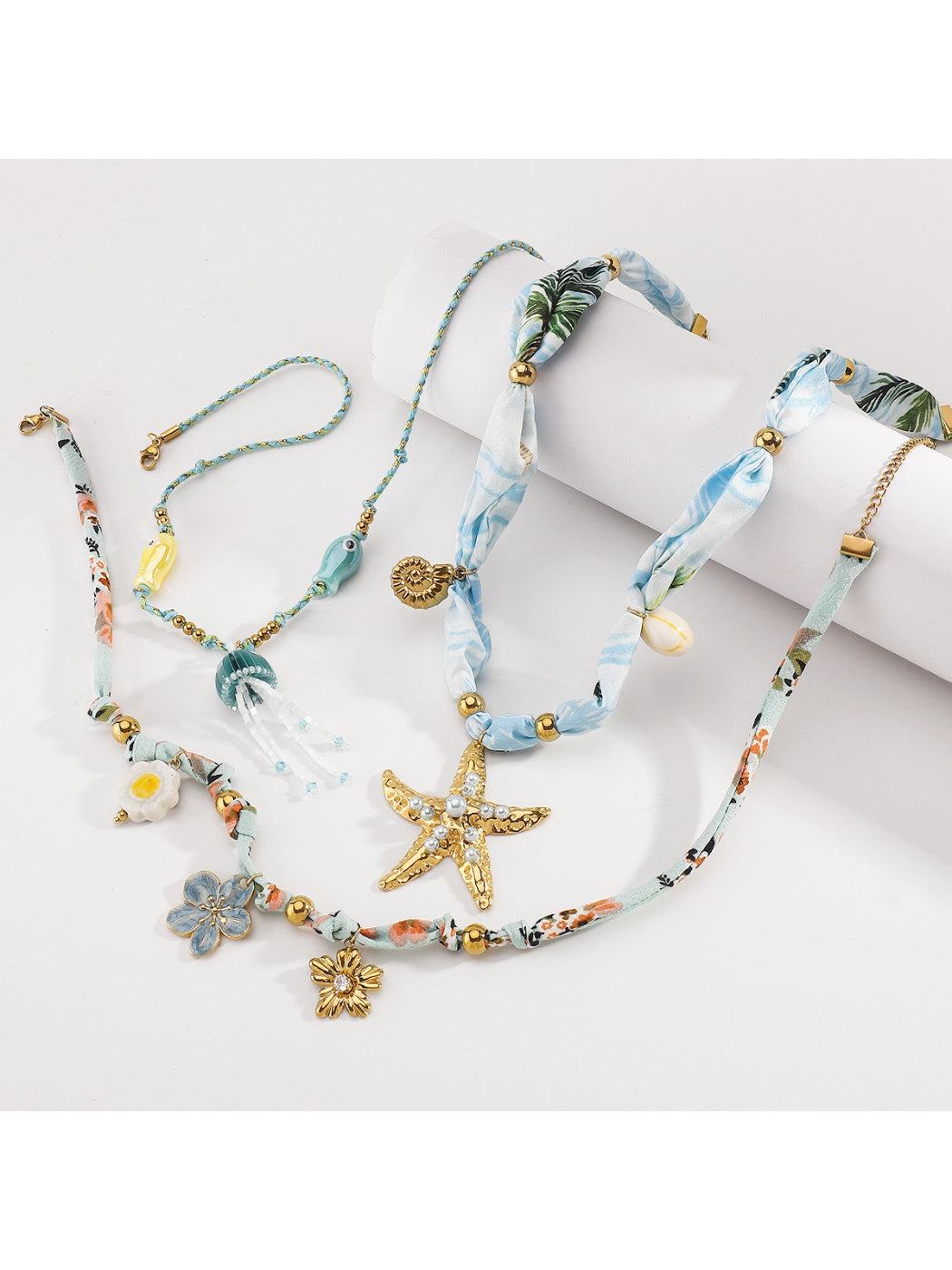 Ocean Charm necklace coiled showing bead pattern and clasp detail