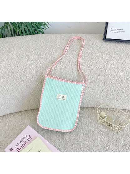 Cosbai Soft Gingham Trim Tote Bag displayed on a wooden surface with lighting
