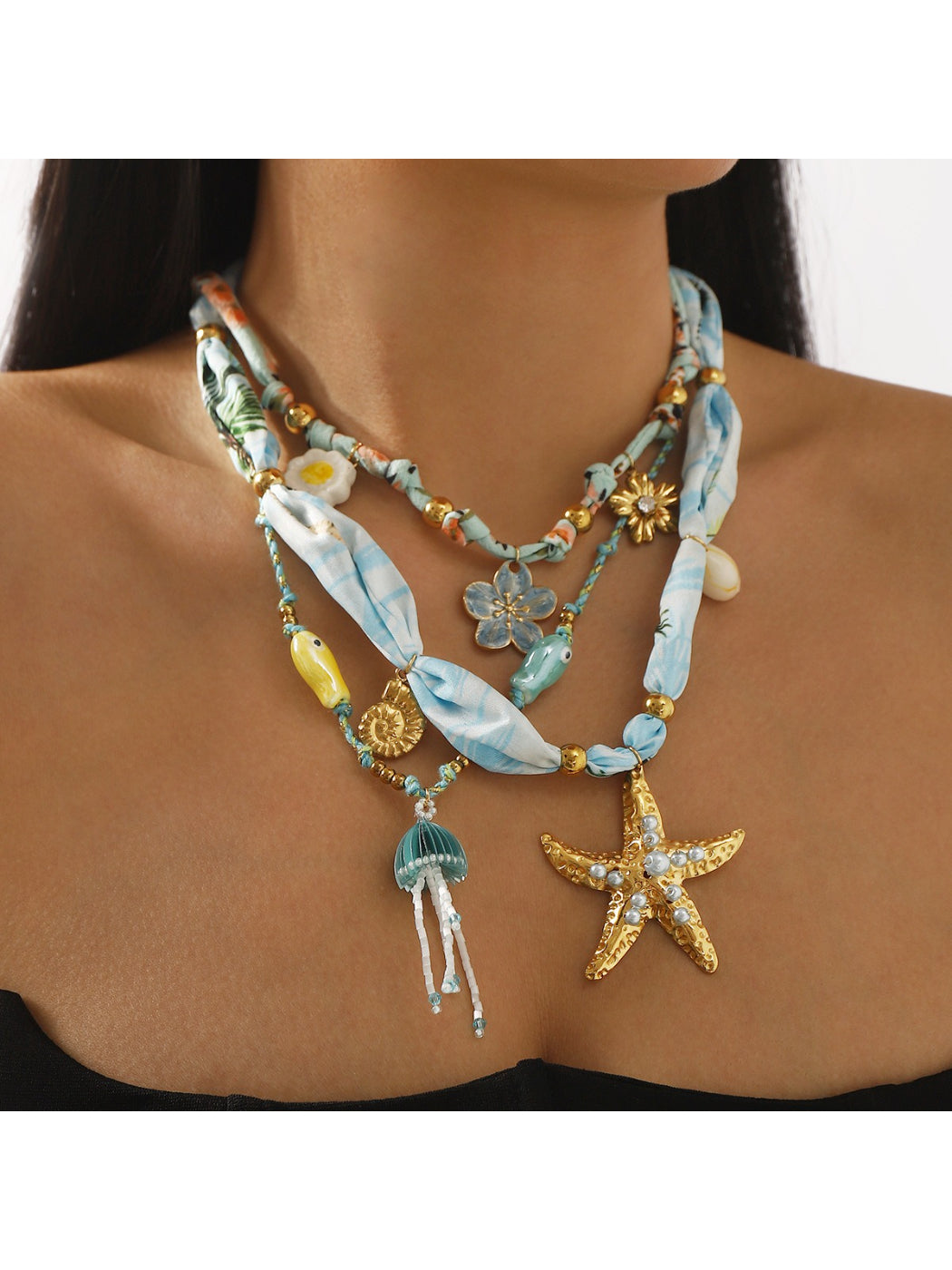 Close-up of Ocean Charm necklace showing detailed blue and white beads