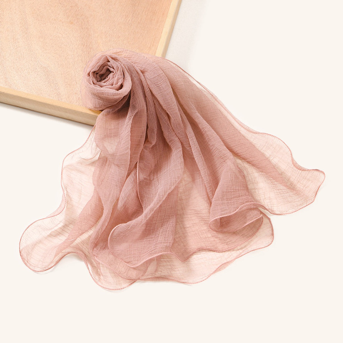 Side view of Scarvii textured shawl scarf with wavy edges on a mannequin