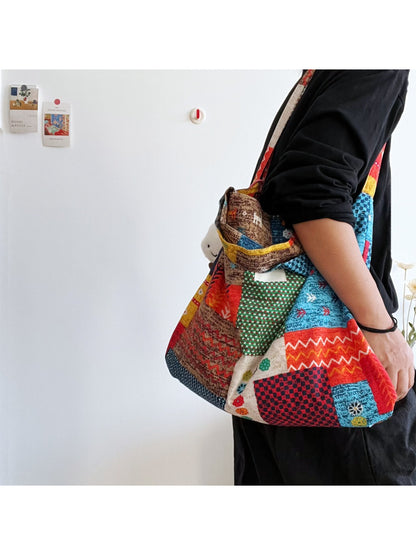 Cosbai patchwork tote bag with multicolor fabric panels and cloud charm hanging from handle