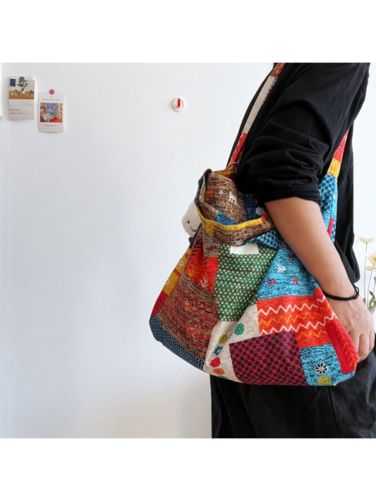 Cosbai patchwork tote bag with multicolor fabric panels and cloud charm hanging from handle