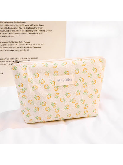 Side view of Cosbai small floral embroidered makeup cosmetic pouch highlighting embroidery