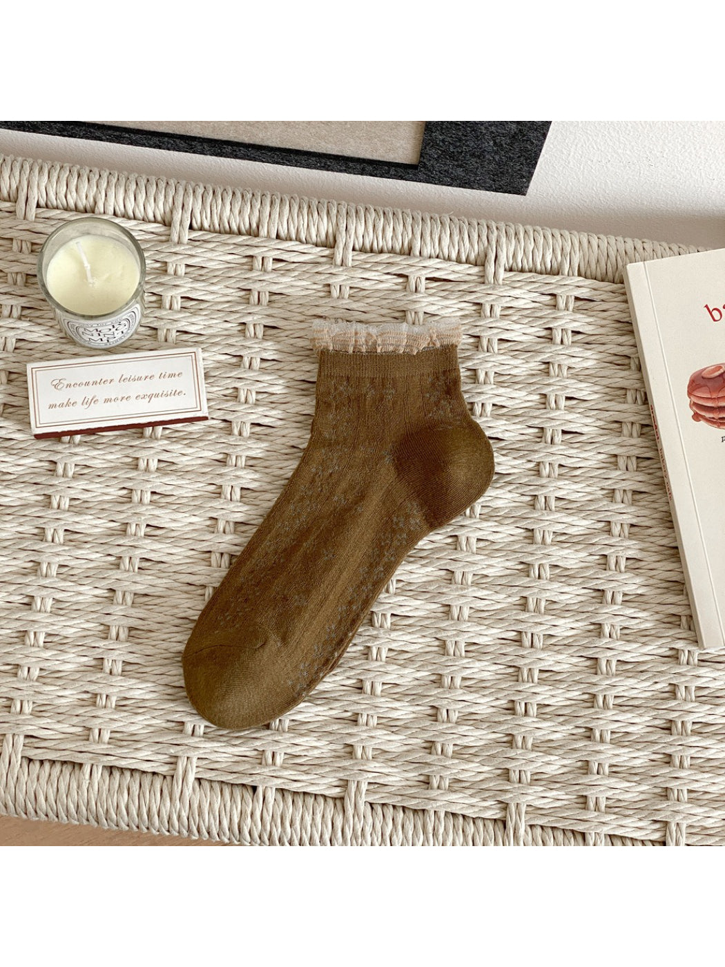 Rufia fine pointelle socks worn on feet with casual shoes and rolled-up pants