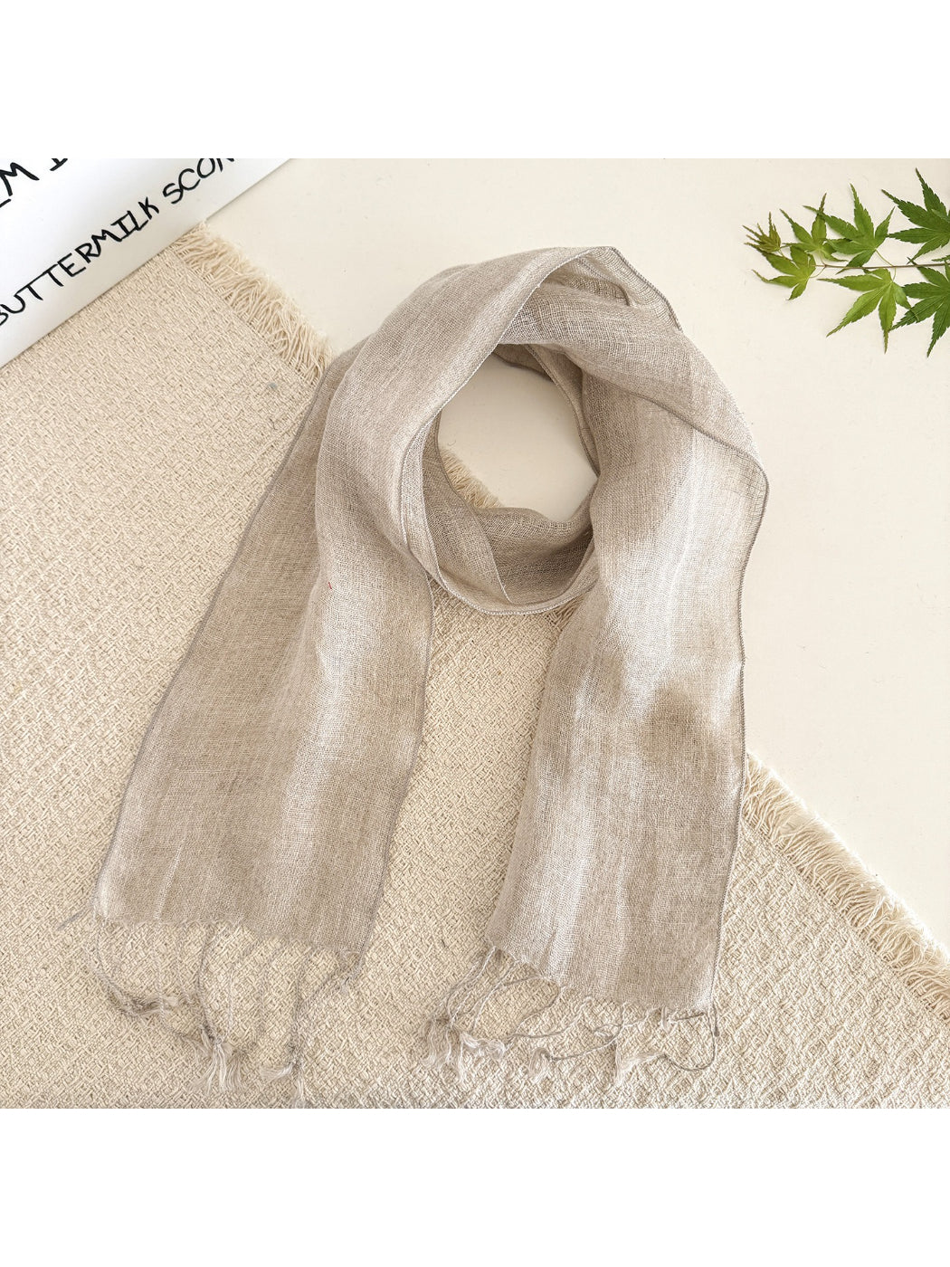Folded sheer solid summer scarf displaying smooth, lightweight material