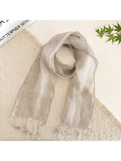 Folded sheer solid summer scarf displaying smooth, lightweight material