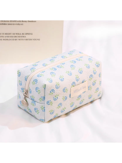 Cosbai travel cosmetic bag standing upright with bright printed pattern