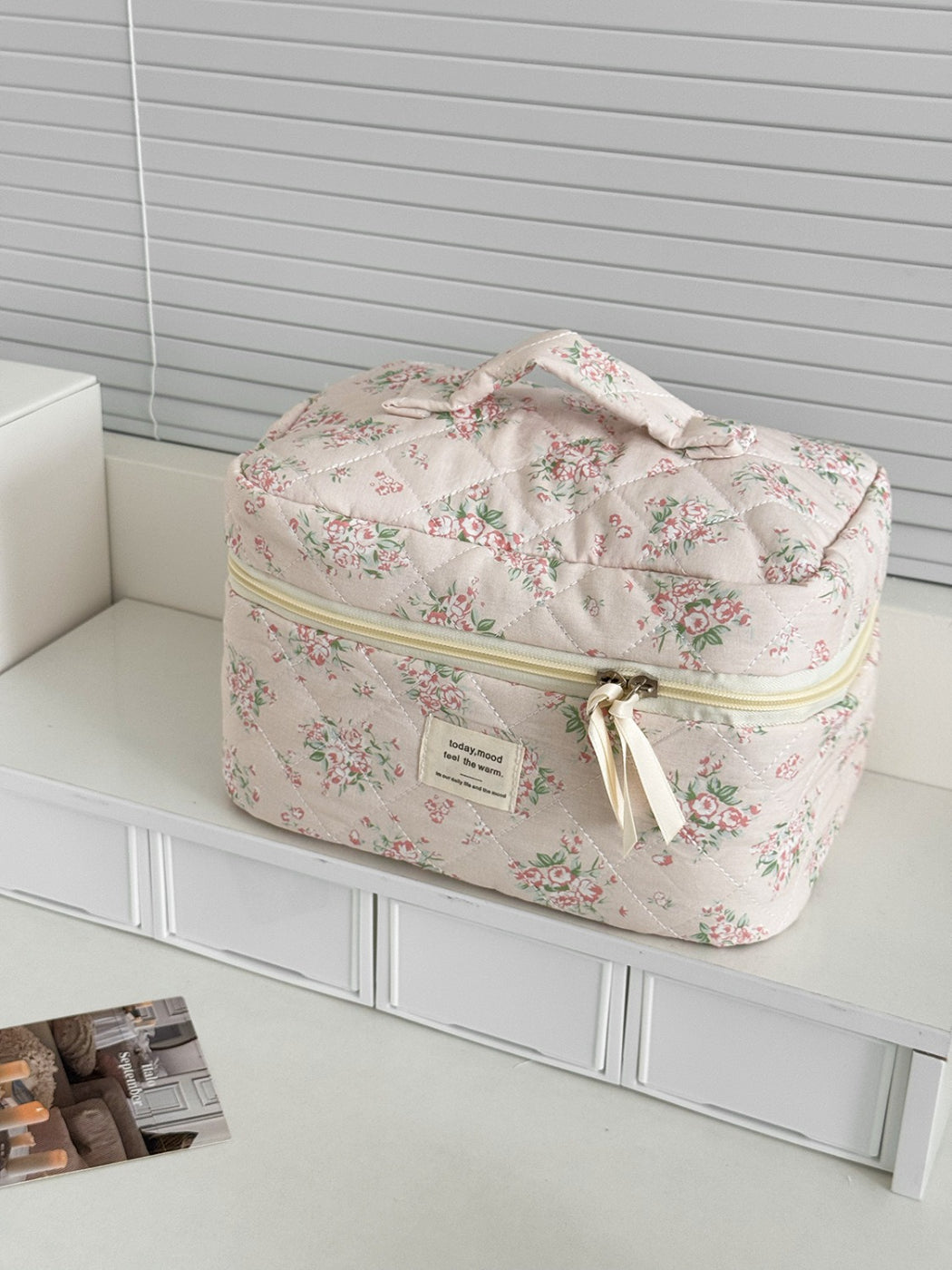 Cosbai beauty storage case displayed with makeup brushes and cosmetics inside