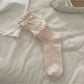 Rufia Ribbon Ruffle Crew Socks displayed with focus on soft fabric and ruffle detail