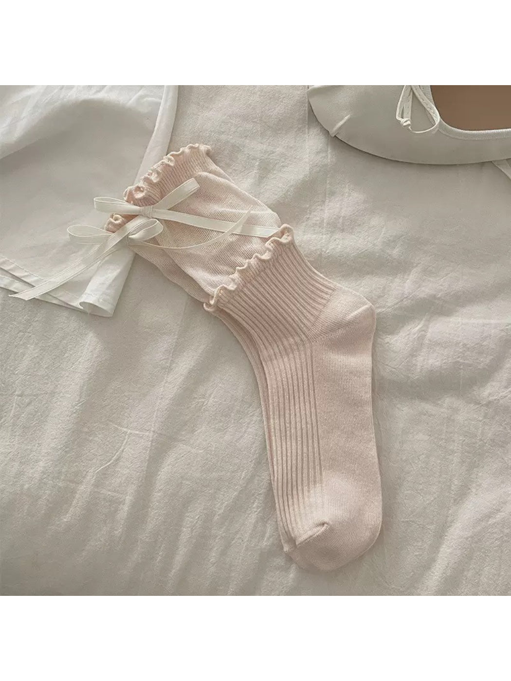 Rufia Ribbon Ruffle Crew Socks displayed with focus on soft fabric and ruffle detail