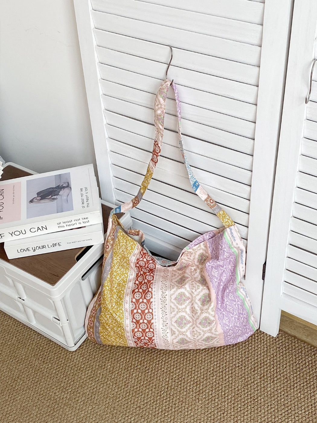 Cosbai soft floral shoulder bag worn over shoulder with casual outfit
