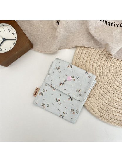 Cosbai Floral Print Coin Pouch with vibrant floral print in natural light