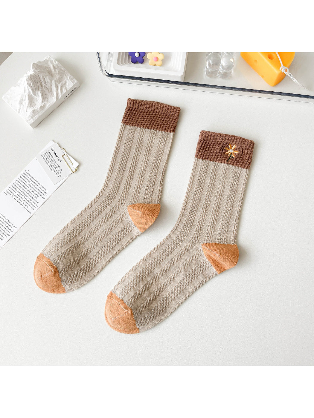 Side view of Rufia Woodland Bloom socks highlighting the mixed floral patterns