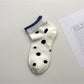 Pair of Rufia Dot Color Block Low Cut Socks laid flat displaying color block design