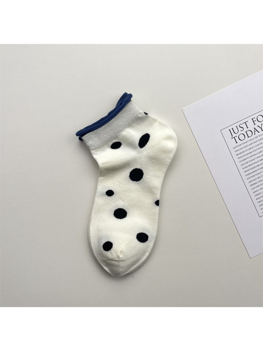 Pair of Rufia Dot Color Block Low Cut Socks laid flat displaying color block design