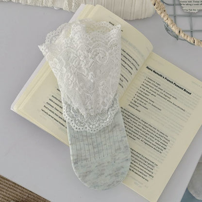 Flat lay of Rufia romantic lace trim crew socks with matching accessories