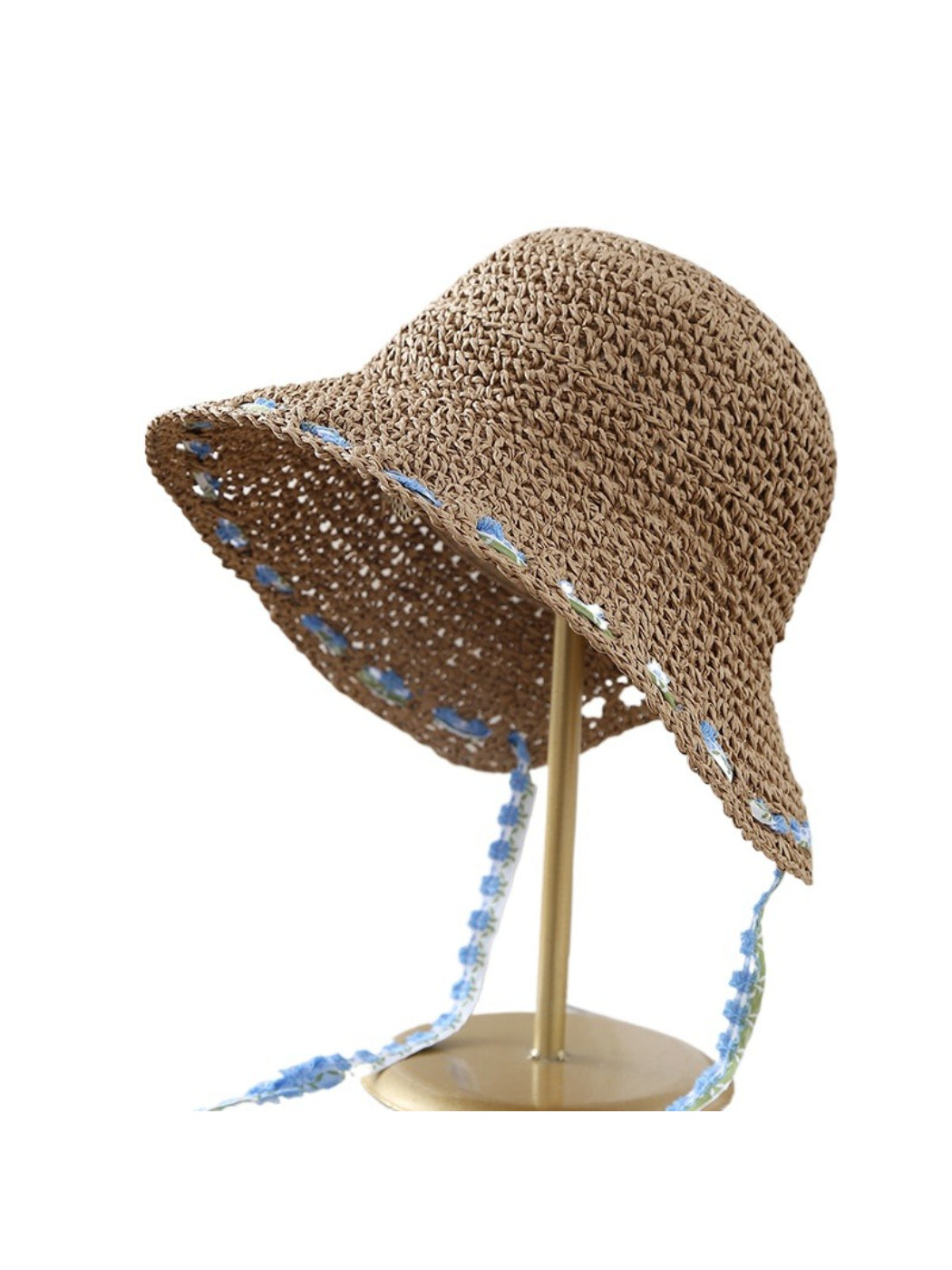 Haila floral trim straw bucket hat worn on a mannequin head