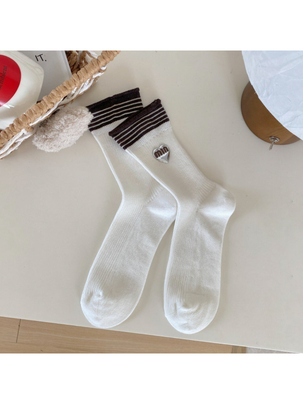 Model wearing Rufia casual neutral crew socks with rolled-up jeans