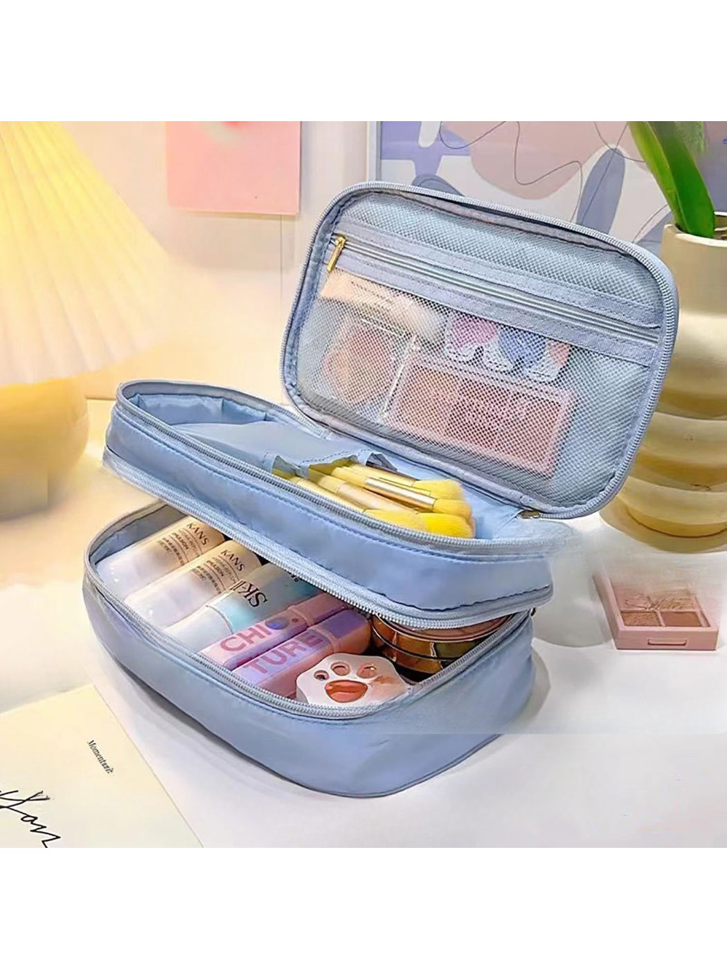 Open view of Cosbai travel cosmetic organizer showing organized makeup and toiletry items