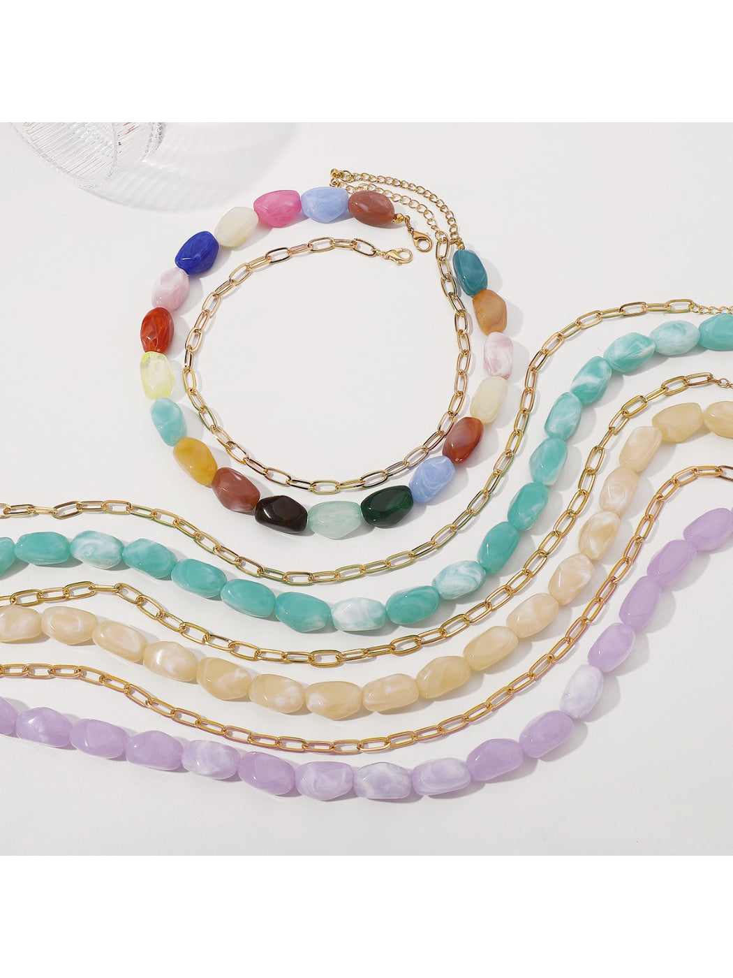 Multicolor beaded necklace laid flat showing full length and clasp
