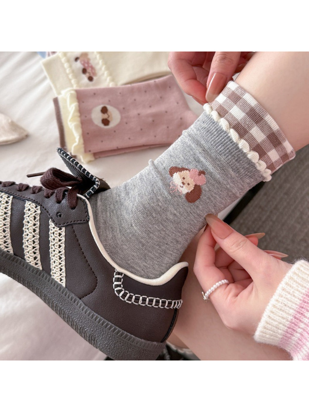 Close-up of Rufia Dog Color Block Mid-Calf Socks showing blue and beige color pattern