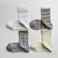 Rufia lace white mid-calf socks displayed flat on a white background