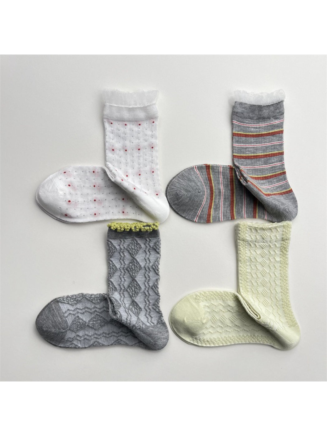 Rufia lace white mid-calf socks displayed flat on a white background