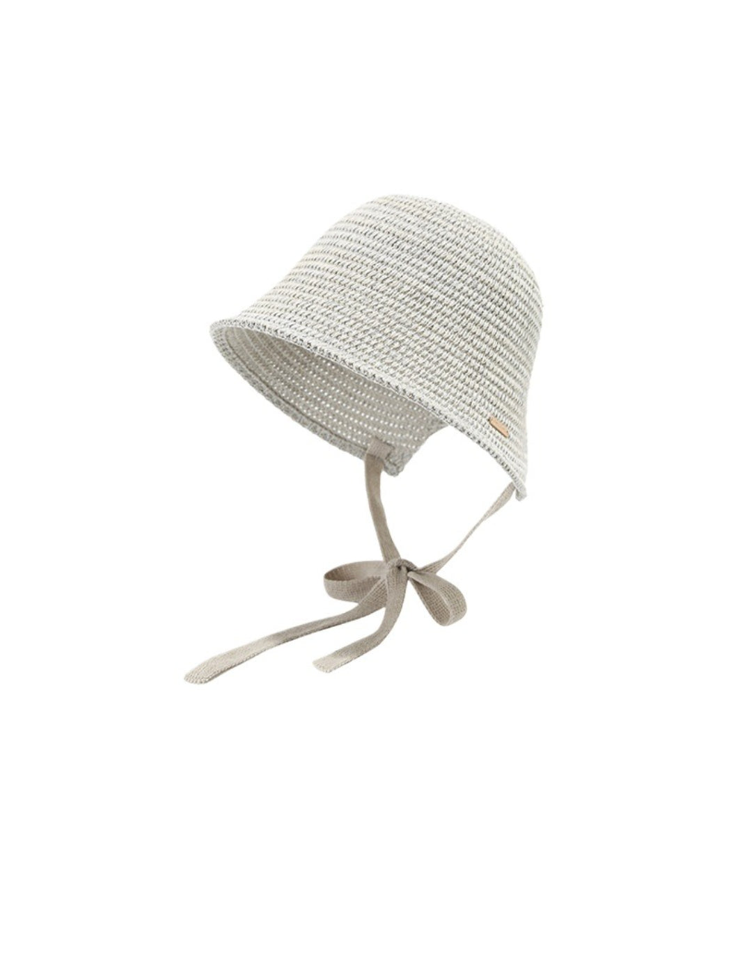 Haila woven straw bucket hat with ribbon tie photographed outdoors with natural light