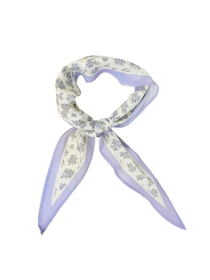Scarvii Ditsy Floral Triangle Scarf styled as a headband on model with floral design