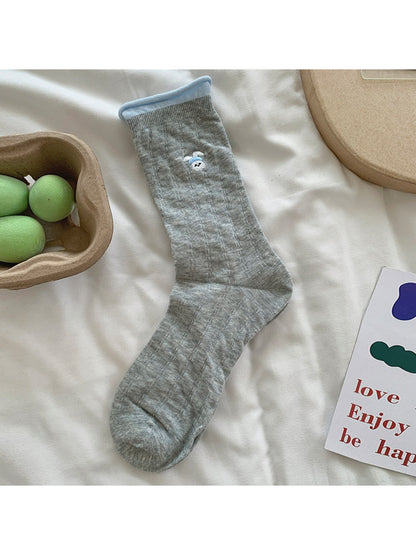Top view of Rufia soft roll cuff socks emphasizing the colorful character print