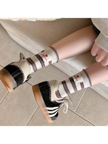 Rufia neutral crew socks folded neatly showing heel and toe details