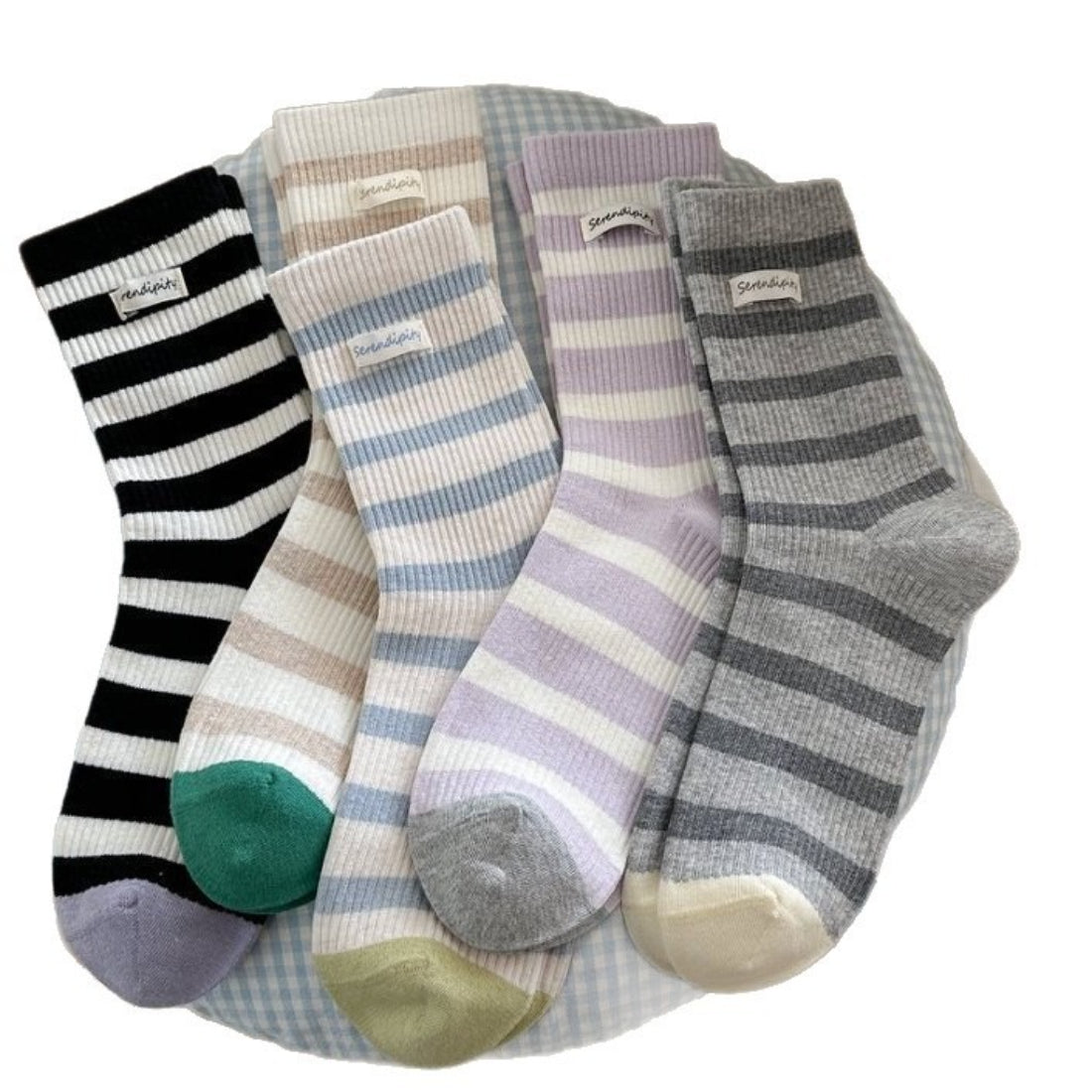 Side view of Rufia soft ribbed stripe crew socks on a model