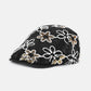 Haila floral sequin vintage newsboy cap worn on a mannequin head