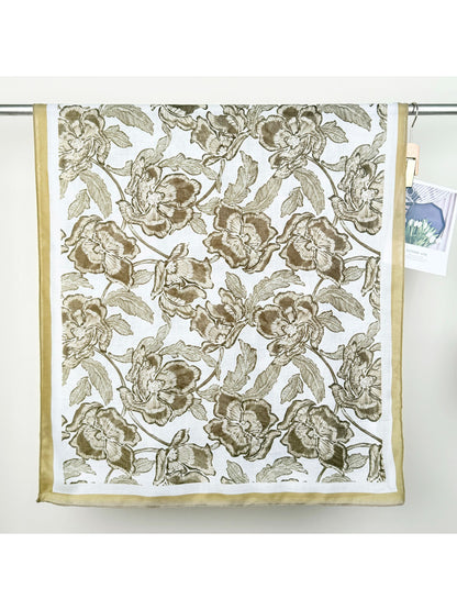 Flat lay of Scarvii floral illustration wrap scarf showing full pattern and colors