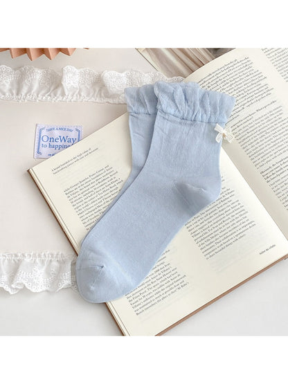 Folded Rufia ruched ankle socks showing bow charm and soft fabric